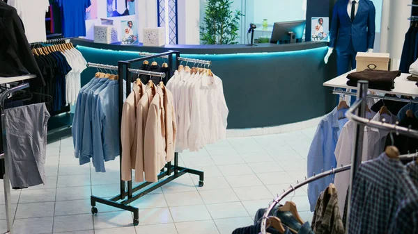 Shopping center showroom with clothes from trendy collections, retail market boutique with modern and fashionable wear. Empty clothing store filled with new trends and fashion brands.