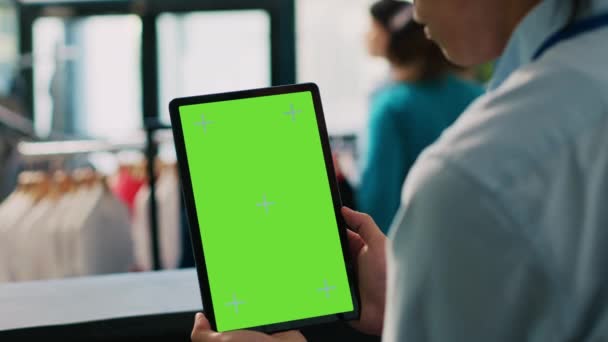 Asian Store Worker Holding Chroma Key Green Screen Mock Tablet — Stock Video