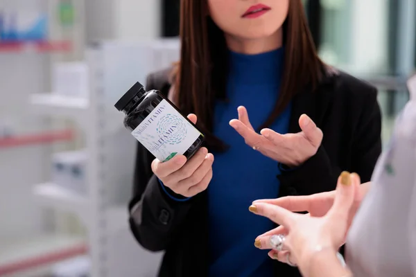 Customer Asking Pharmacist Find Multivitamin Showing Supplement Bottle Drugstore Buyer — Stock Photo, Image