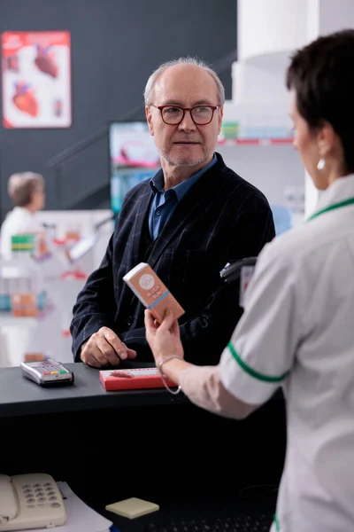 Old Man Glasses Waiting Drugstore Cashier Scanning Product Pay Young — Stock Photo, Image