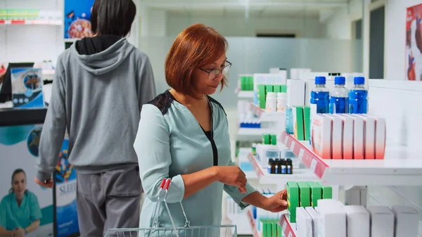 Female Customer Reading Boxes Vitamins Shelves Pharmacy Store Looking Packages — Stock Photo, Image