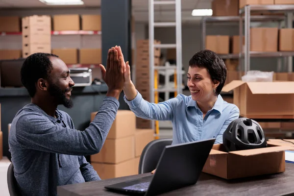 Smiling Workers Doing High Five Putting Helmet Order Client Cardboard — Stock Photo, Image