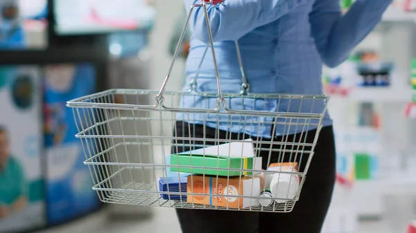 Female Client Putting Boxes Medicine Basket Buying Pharmaceutical Products Supplements — Fotografia de Stock