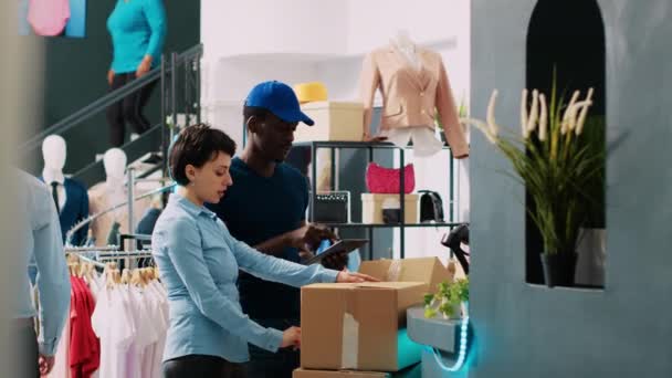 Worker Looking Packages Courier Discussing Shipping Details Modern Boutique African — Stock Video