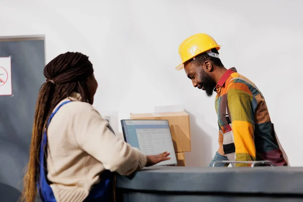 African American Warehouse Colleagues Chatting Counter Desk While Checking Invoice — Stock Photo, Image