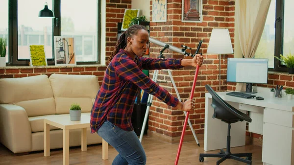 Cheerful Girlfriend Dancing Apartment Using Mop Sweep Floors Listening Music — Stok fotoğraf