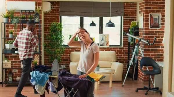 Furious Wife Throwing Garment Husband Being Frustrated Ironing Clothes Home — Stockfoto