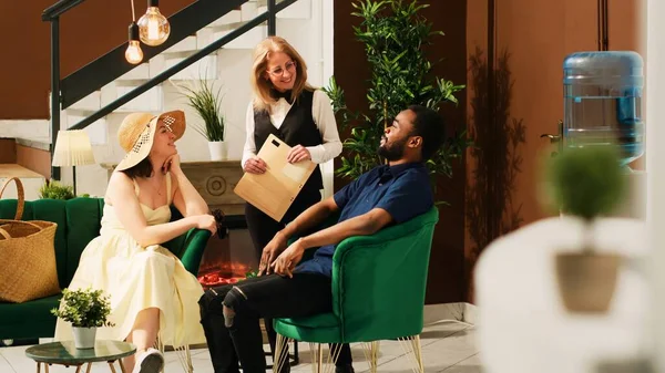 Employee Providing Great Service Tourists Sitting Lounge Area Hotel Worker — Stock Photo, Image