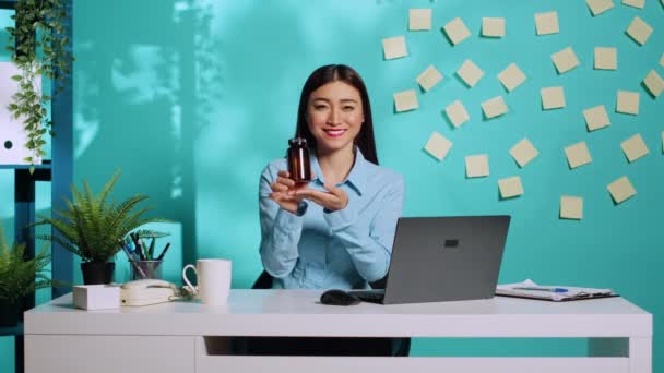 Cheerful Affable Asian Medical Saleswoman Proudly Presenting Pill Bottle Showing — Stock Video
