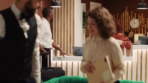 Tourists Booking Stay Stylish Posh Hotel Assisted Helpful Smiling Receptionist — Stock Video
