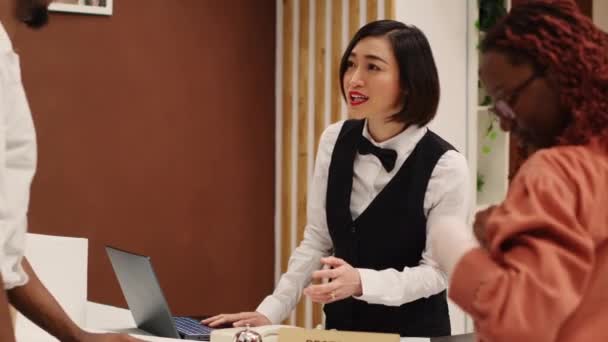 Happy Friendly Asian Receptionist Helping Guests Check Process Imputing Personal — Stock Video