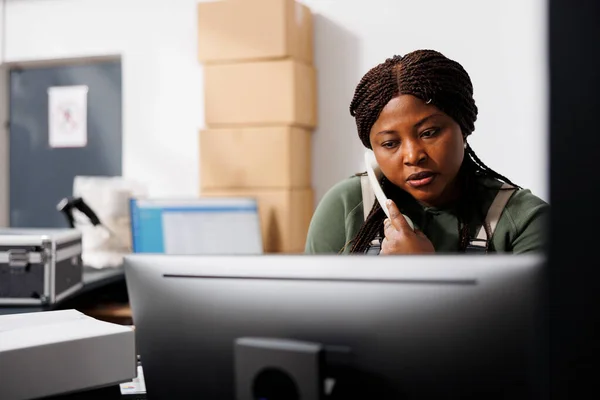 African American Worker Talking Landline Phone Remote Client Discussing Delivery — Stock Photo, Image