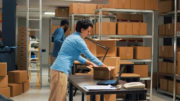 Young Startup Owner Putting Merchandise Boxes Working Laptop Goods Inventory — Stock Photo, Image