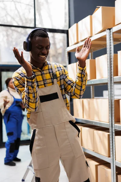 Happy African American Man Enjoying Music Warehouse Work Dancing Clapping — Stock Photo, Image