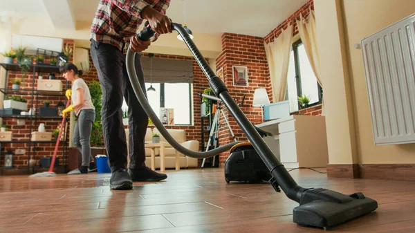 African American Man Vacuuming Floors Living Room Cleaning Apartment Girlfriend — Stock Photo, Image