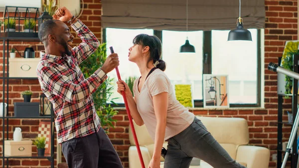 Modern Smiling Couple Dancing Cleaning Apartment Mopping Vacuuming Living Room — Stock Photo, Image