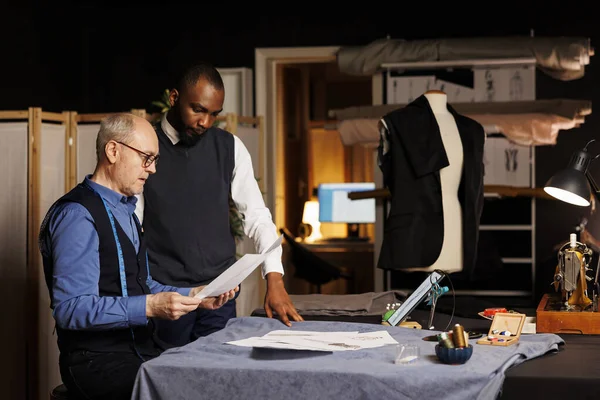 Skilled Tailors Comparing Different Fashion Sketches Attire Combinations Atelier Workspace — Stock Photo, Image
