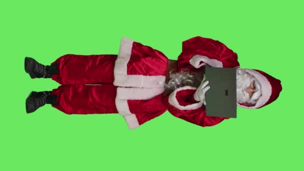Vertical Video Front View Santa Claus Cosplay Works Laptop Greenscreen — Stock Video