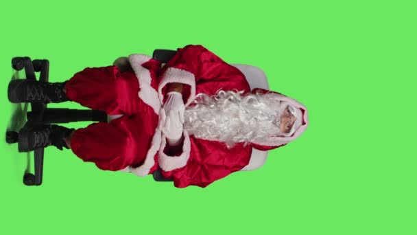 Vertical Video Front View Saint Nick Embodiment Sitting Chair Posing — Stock Video