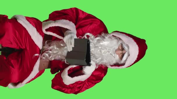Vertical Video Front View Saint Nick Using Tablet Studio Sitting — Stock Video
