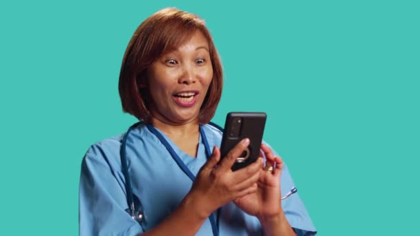 Jubilant Nurse Having Burst Joy Work While Chatting Friends Isolated — Stock Video