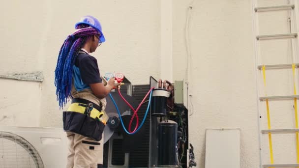 Skilled African American Expert Looking Freon Levels Air Conditioner While — Video