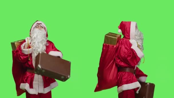 Joyful Adult Disguised Santa Suit Holding Suitcase Waiting Something Studio — Stock Video