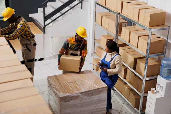 African American Warehouse Loader Giving Cardboard Box Supervisor Post Office — Stock Photo, Image
