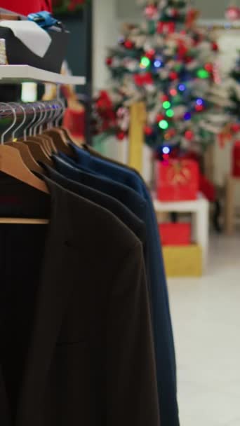 Vertical Video Dolly Shot Festive Clothing Store Filled Beautifully Decorated — Stock Video