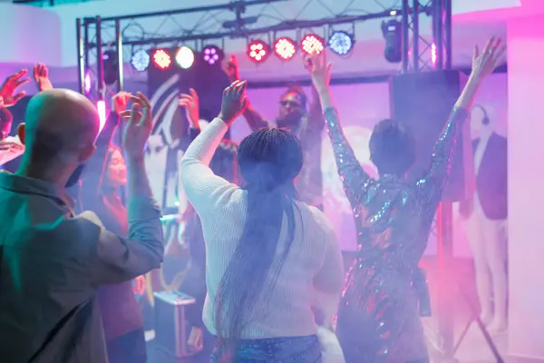 Energetic Crowd Dancing Enjoying Discotheque Dancefloor Colorful Spotlights People Jumping — Stock Photo, Image