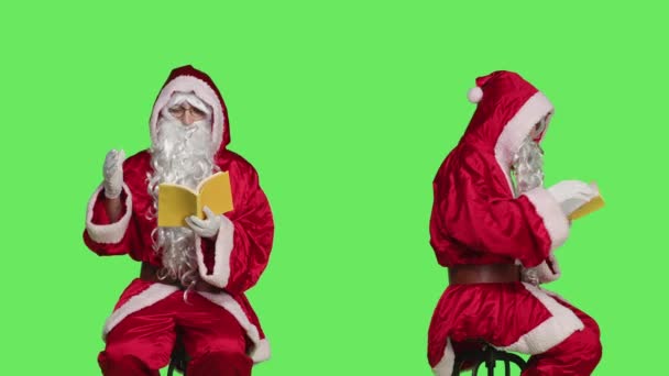 Saint Nick Reads Lecutre Novel Chair Man Dressed Santa Claus — Stock Video