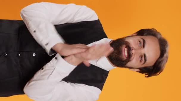 Vertical Video Passionate Waiter Applauds Both Hands Studio Congratulate Someone — Stock Video