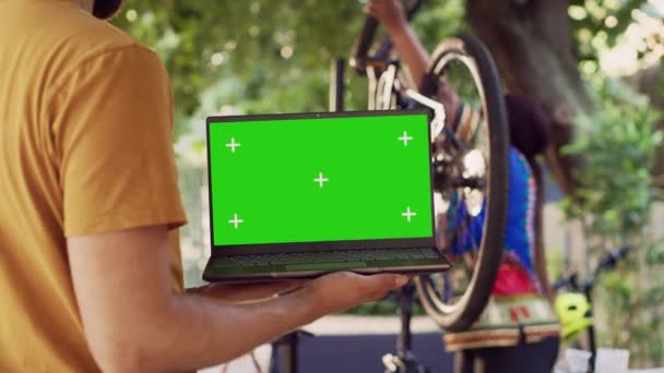 Close Shot Laptop Isolated Chromakey Display Carried Male Cyclist While — Stock Video