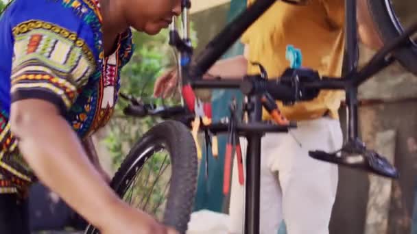 Active Sporty Interracial Couple Safely Securing Front Bicycle Tire Repair — Stock Video