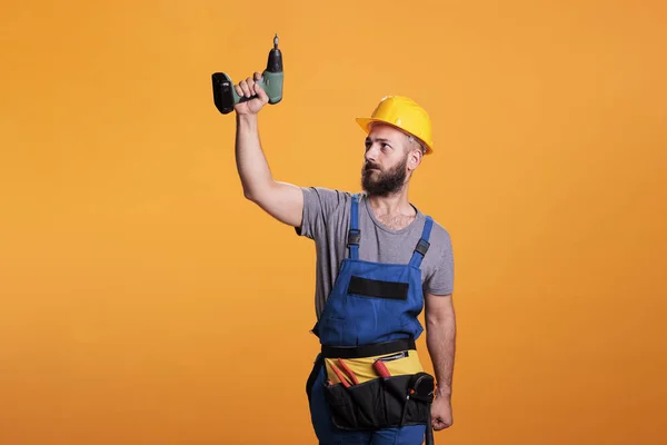 Young Carpenter Working Wtih Electric Power Drill Tool Wearing Overalls — Stock Photo, Image
