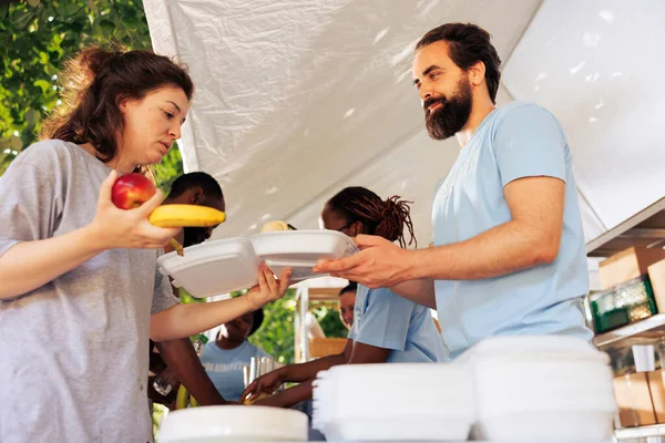 Friendly Charity Workers Assisting Less Fortunate Offering Humanitarian Aid Food — Stock Photo, Image