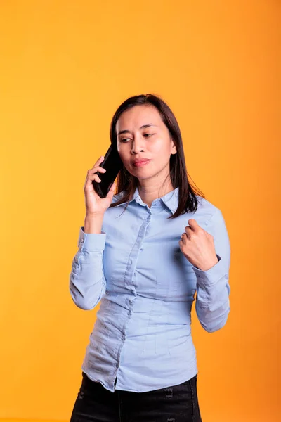 Cheerful Asian Woman Talking Telephone Line Answering Phone Call Yellow — Stock Photo, Image