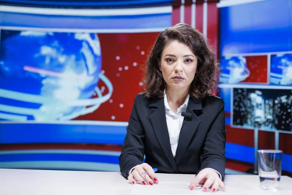 Anchorwoman reporting live information regarding daily events, hosting media segment on global television broadcast. Newscaster presenting reportage with latest breaking news.