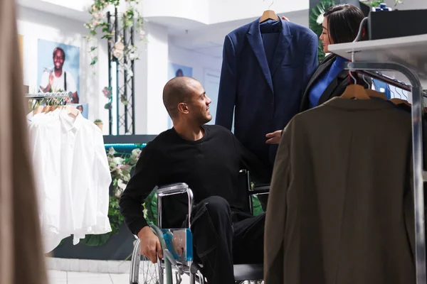 Smiling Arab Man Buyer Disability Examining Trendy Jacket Style While — Stock Photo, Image