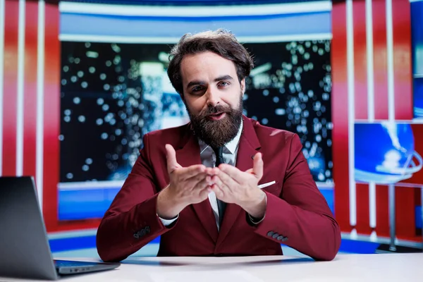 Talk show host addressing daily events in news studio, reporting live information about latest occurences worldwide. Man presenter creating reportage on international tv channel.