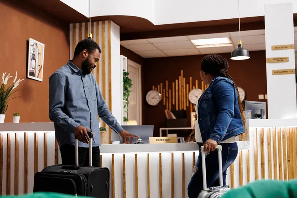 African American Family Couple Standing Luggage Empty Reception Desk Pressing — стоковое фото
