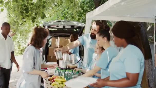 Hunger Relief Team Comprising African Americans Caucasians Distribute Donated Food — Stock Video