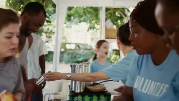Outdoor Food Bank Multiethnic Female Volunteers Giving Homeless Free Food — Stock Video