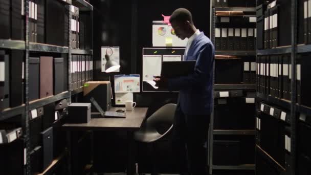 Neatly Organised Office African American Detective Examines Evidence Intention Solving — Stock Video