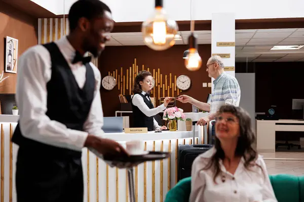 Arrival Hotel Reception Elderly Male Customer Checks Receptionist Assistance Front — Stock Photo, Image