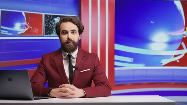 News anchor discuss latest events live on tv program, creating broadcast reportage with daily issues and headlines. Man journalist presenting breaking news on television, newsroom.