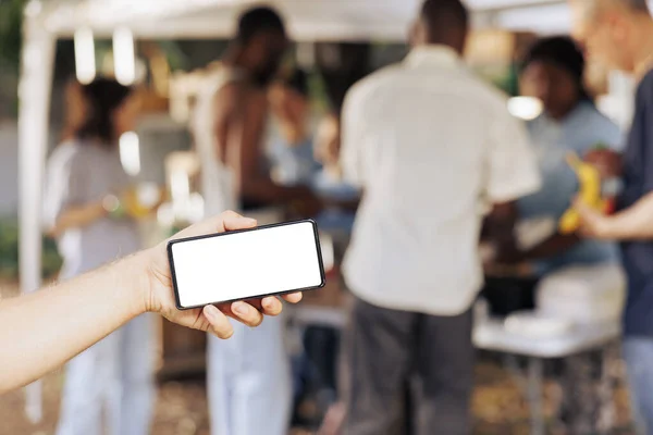 Detailed Shot Caucasian Person Hunger Relief Event Gripping Digital Device — Stock Photo, Image