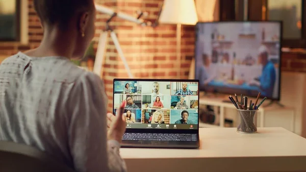 Woman attends videocall meeting with partners online, discussing about important freelancing tasks to finish. Teleworker talking to contractor on telework chat, remote job at home.
