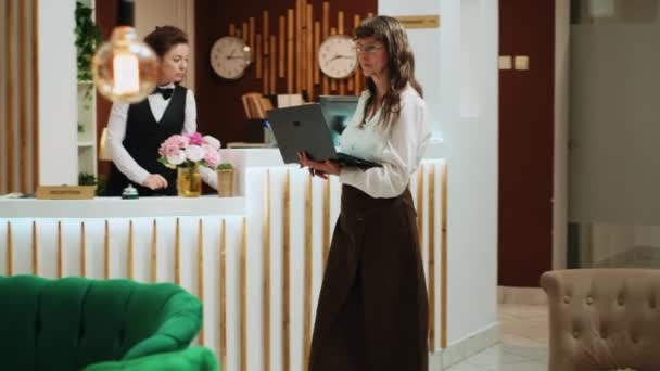 Senior Woman Using Laptop Lobby Lounge Area Navigating Online Network — Stock Video