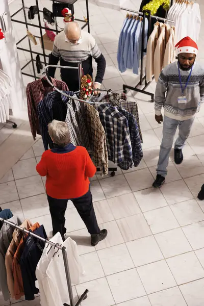 Various Shoppers Looking Clothing Items Racks Shopping Center While Seeking — Stock Photo, Image
